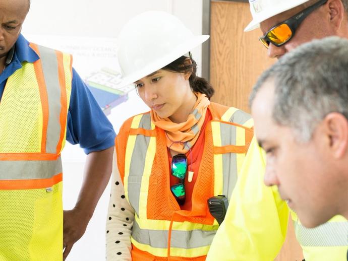 Diverse Keller employees meeting around a table